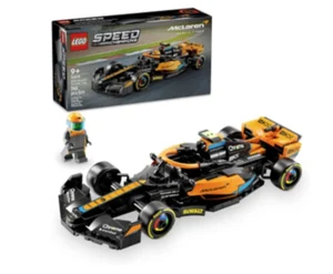 Imagem de um conjunto LEGO da linha Speed Champions com o tema McLaren Fórmula 1. O conjunto inclui um carro de corrida preto e laranja com muitos detalhes aerodinâmicos e adesivos de patrocinadores, além de uma miniatura de piloto com capacete. Ao fundo, a caixa exibe o mesmo carro em alta velocidade numa pista de corrida. Indicado para maiores de 9 anos e contém 264 peças.
